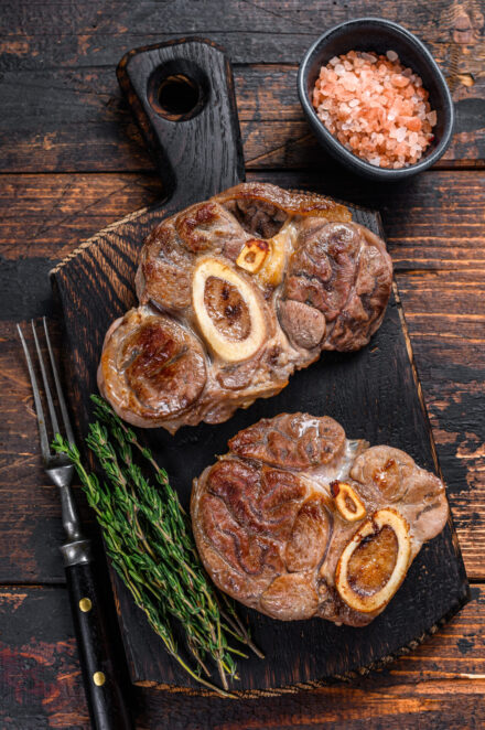 Stewed meat on the bone Osso Buco beef shank, italian ossobuco